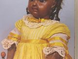 a book with a picture of a little girl in a yellow dress