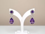 amethorate and diamond earrings on a white stand