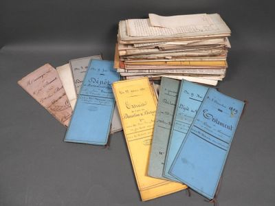 several old books are stacked on top of each other on a table