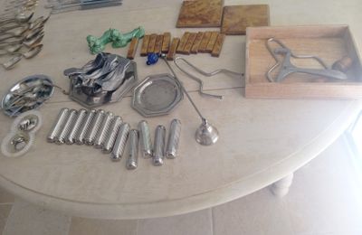 a table with a lot of silverware on top of it