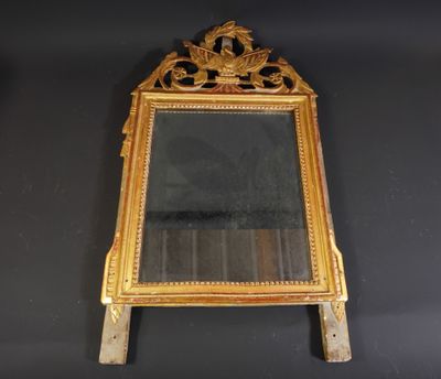 an image of a mirror hanging on a wall with a black background