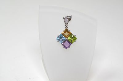 a close up of a necklace on a mannequin display