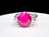 an image of a pink stone ring on a white plate