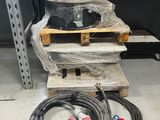 two hoses sitting on a pallet in a warehouse