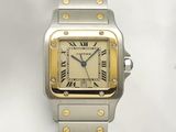 an image of a silver and gold watch with roman numerals