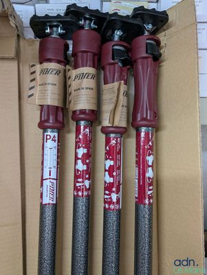 three red and black fire extinguisors sitting in a cardboard box