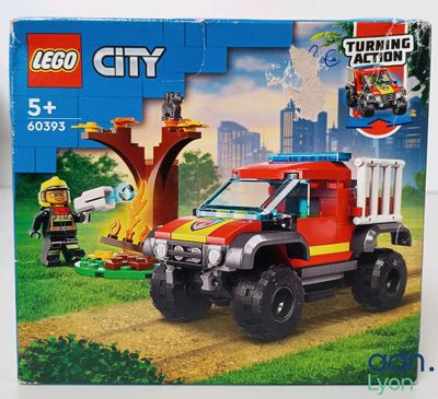 a box with a lego city fire truck in it