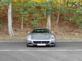 a silver sports car parked on the side of the road