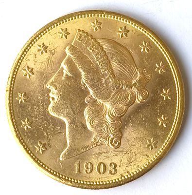 l'image d'une pièce d'or sur laquelle figure le visage d'une femme
