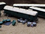 a lot of toy trains that are sitting on the ground