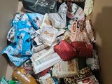 a box full of food that is sitting on the floor