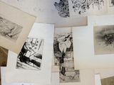 a lot of drawings on the floor of this room