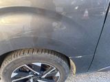 a close up of a car ' s tire on the road