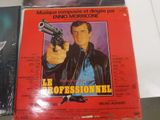 a poster of a man holding a gun in front of a poster of a man holding a gun