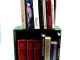 many books that are sitting on a shelf in a box