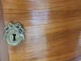 a wooden cabinet with a keyhole in it