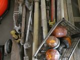 a basket full of assorted tools and tools on the floor