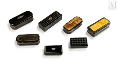 a lot of small black and yellow objects on a white surface