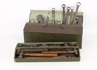 a box with tools in it on a white surface