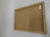 a picture of a wooden frame hanging on the wall