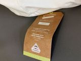 a bag that is sitting on a table next to a pillow