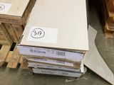 many stacks of boxes on the floor in a warehouse