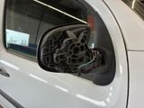a close up of a car ' s side view mirror with wires attached to it