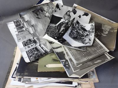 a pile of old photos on top of each other