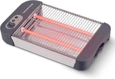 un gros plan d'un radiateur électrique posé sur une surface blanche