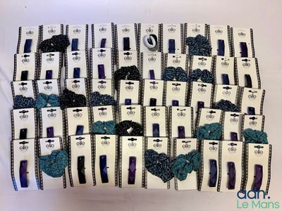 a lot of boxes with blue and black bows on them