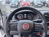 dashboard of a car with a steering wheel and dashboard gauges