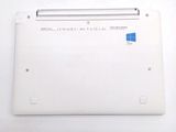 a white laptop with a blue sticker on it