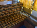 a couch that is sitting in front of a window