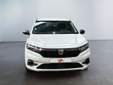 the front view of a white car parked in a room