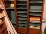 a room with a lot of books on the shelves