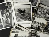 several old black and white photos of people in a boat