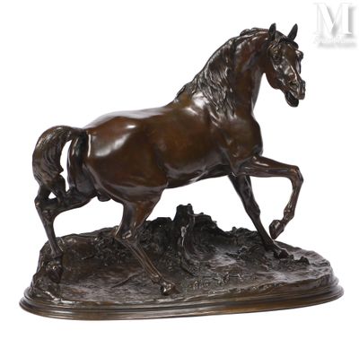 bronze statue of a horse running on a rocky surface