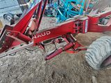 an image of a tractor that is sitting in the dirt