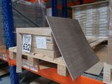 a stack of boxes on a pallet in a warehouse