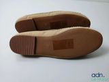 a close up of a pair of shoes on a white surface