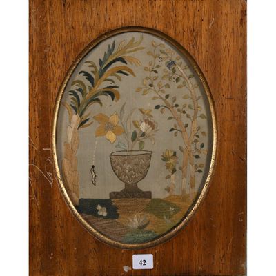 tableau représentant un vase orné de fleurs et de feuilles, dans un cadre en bois