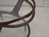 a glass table with a metal frame and a glass top
