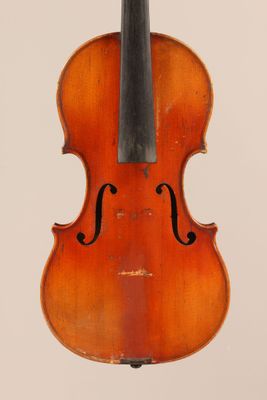 an old violin with a bow hanging from it ' s back