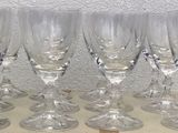 six empty wine glasses sitting on top of a cardboard box