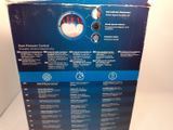 the box is open on a white surface with a blue and black label