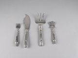 three forks, a knife, and a spoon on a table