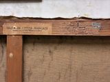a picture of a wooden frame with a sign on it