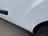 a close up of a white car with a flat tire
