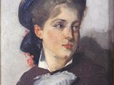 tableau représentant une femme portant un chapeau et un nœud papillon, dans un cadre en bois