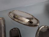 a silver tray with a mirror on top of it